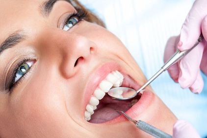Attractive woman undergoing dental exam