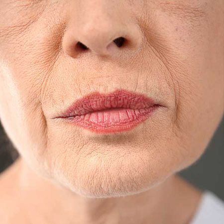 Close up of woman's wrinkles around mouth